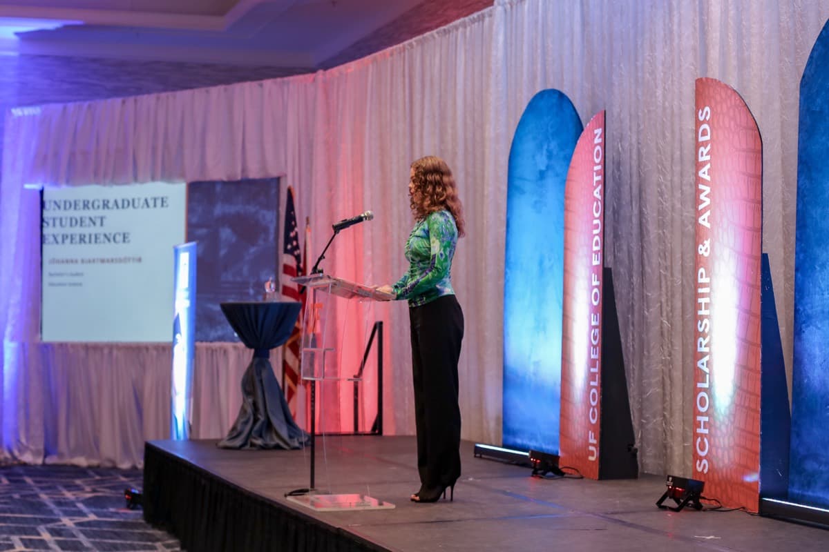 Jóhanna giving a lecture on stage